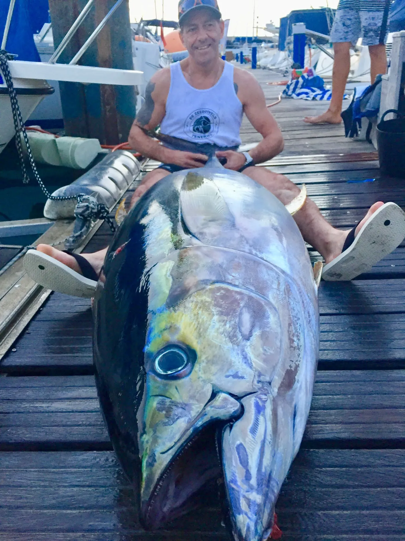 A giant bluefin tuna landed off Tenerife Angler on the dock with a giant bluefin tuna caught off South Tenerife