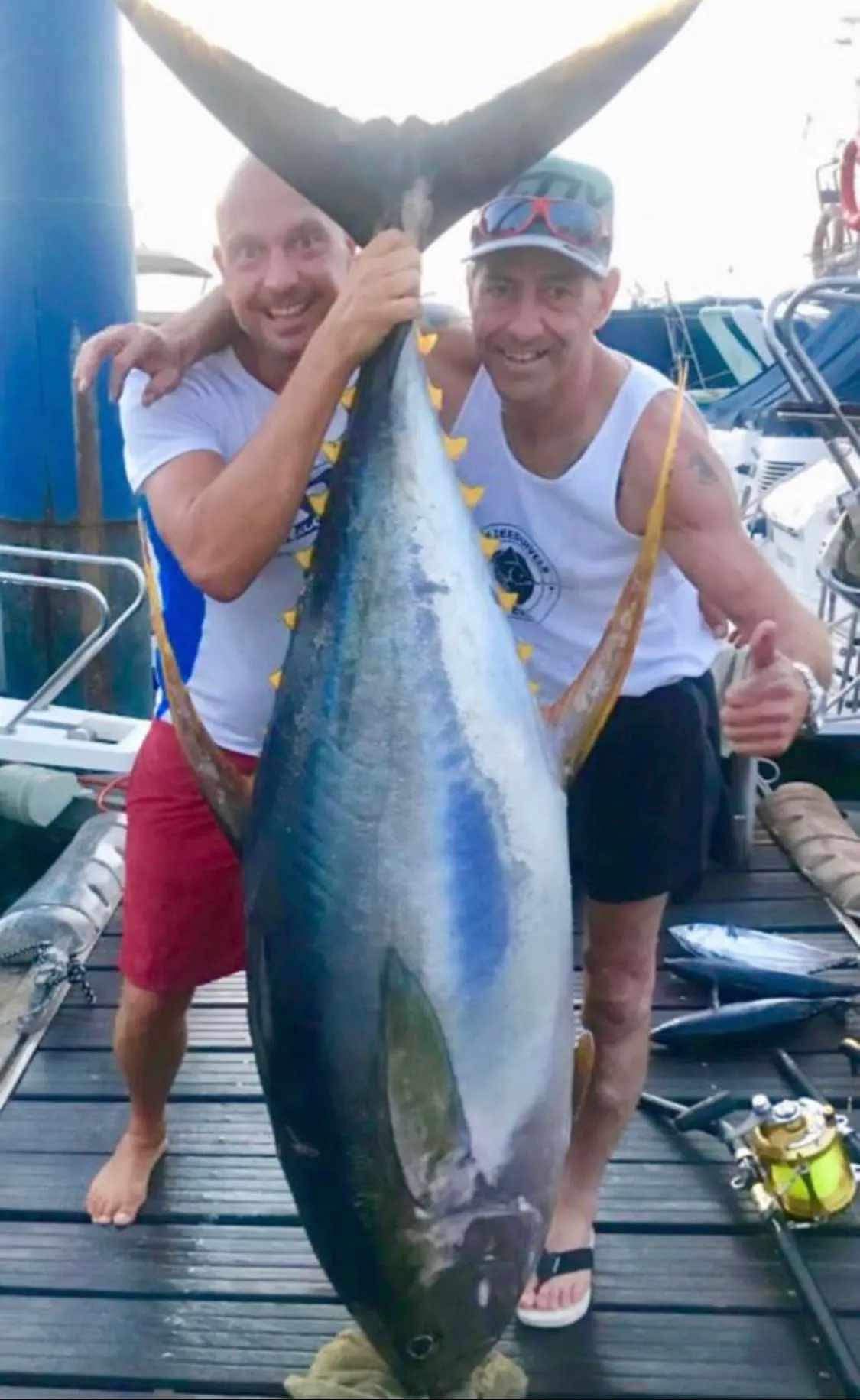 Yellowfin tuna caught off South Tenerife Two anglers holding a big yellowfin tuna caught aboard Mikestrike, Tenerife