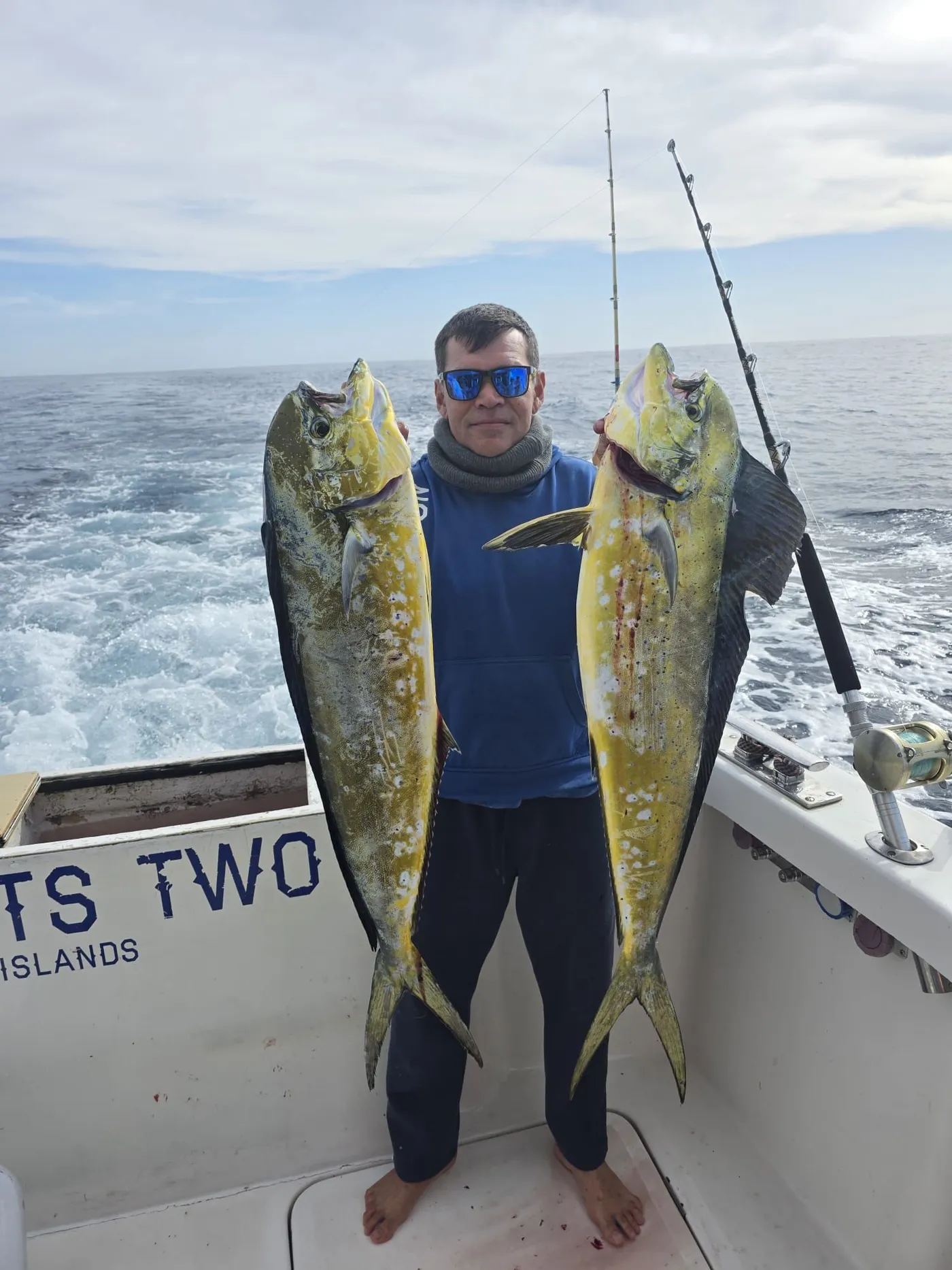 A double of dorado aboard No Limits Two Angler holding two dorado (mahi mahi) aboard No Limits Two, Tenerife