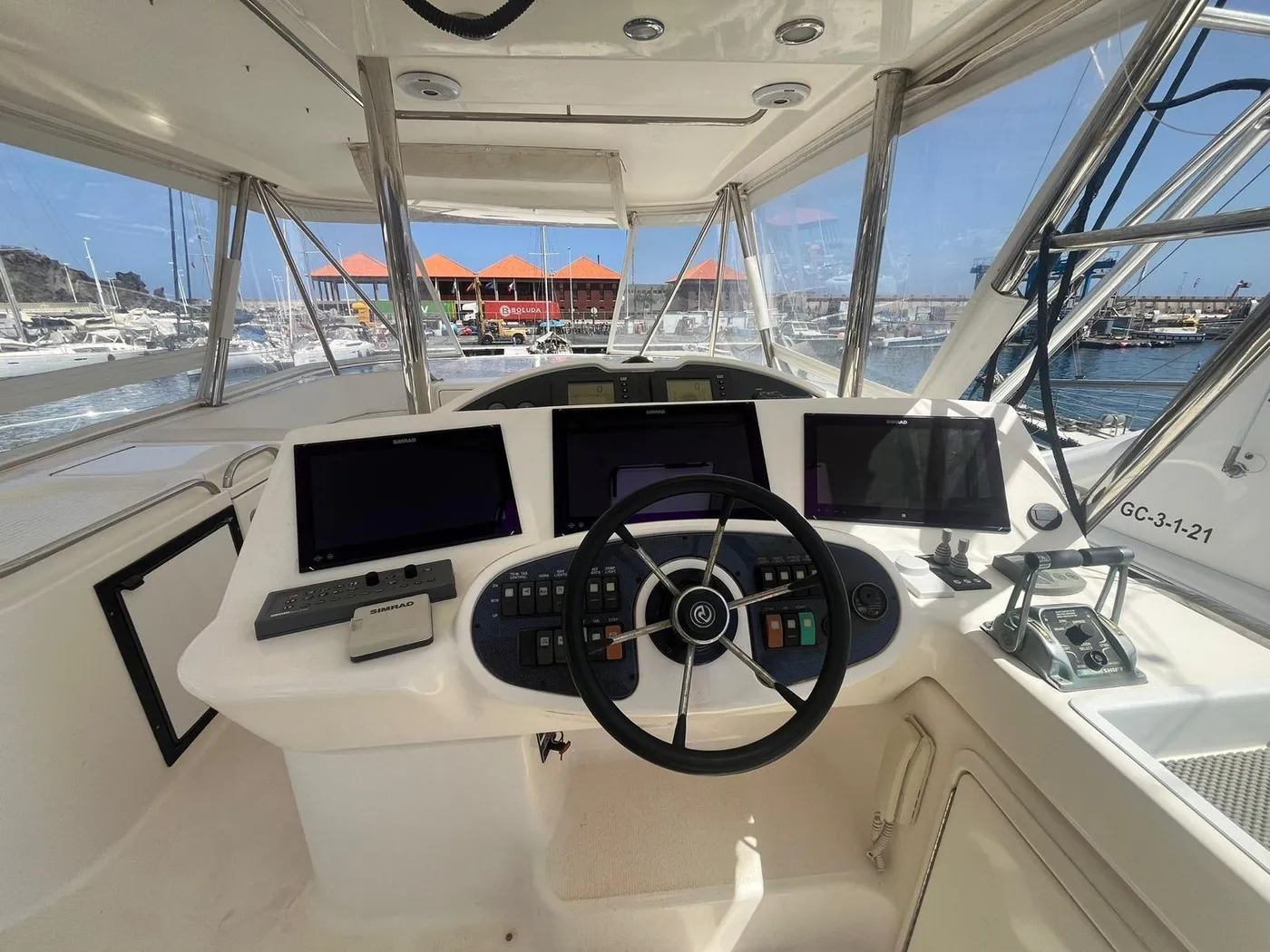 The Tanoa's flybridge helm and electronics The flybridge helm with Simrad electronics aboard the Tanoa yacht, Tenerife