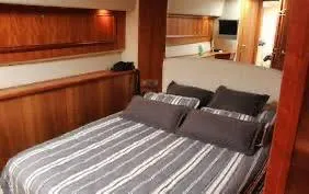 A guest cabin aboard the Tanoa A wood-panelled guest cabin aboard the Tanoa yacht, South Tenerife