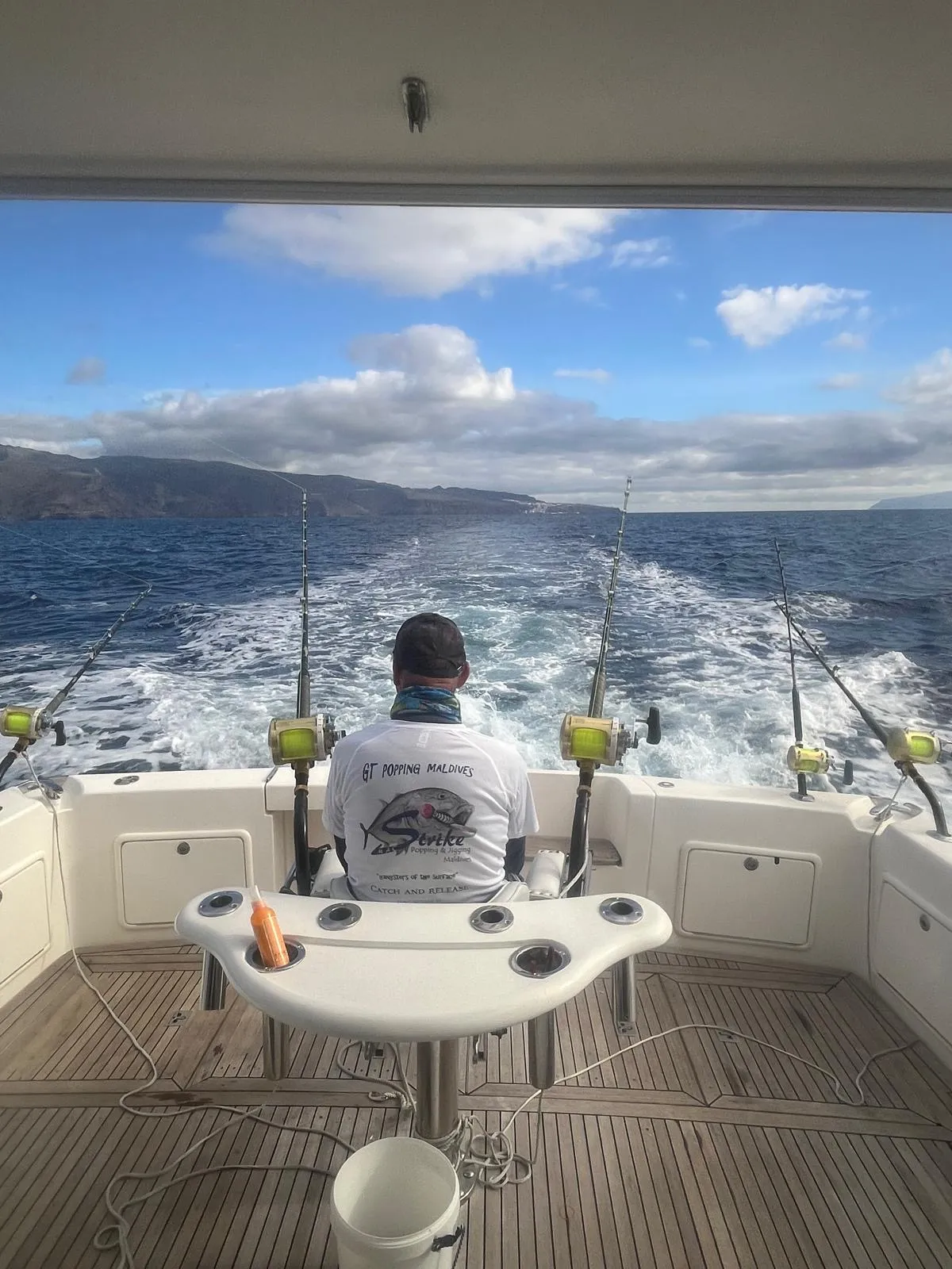 Trolling offshore aboard the Tanoa Trolling from the teak cockpit of the Tanoa yacht offshore Tenerife