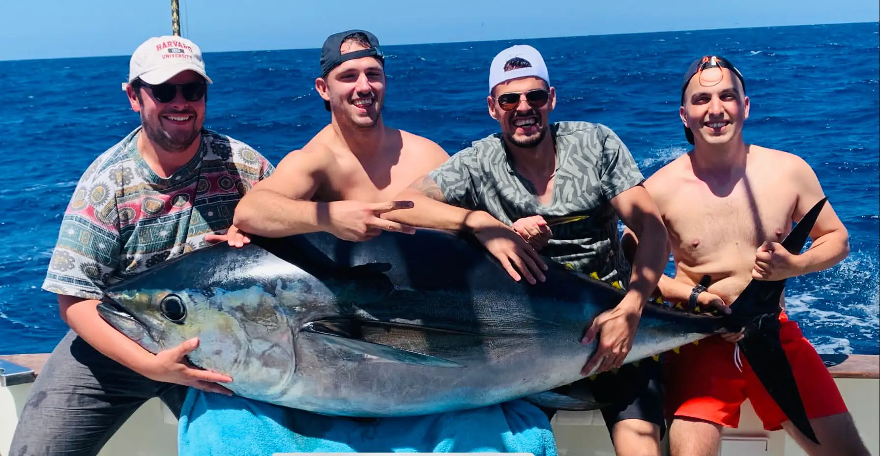 A crew of four guests with a giant bluefin tuna caught off South Tenerife